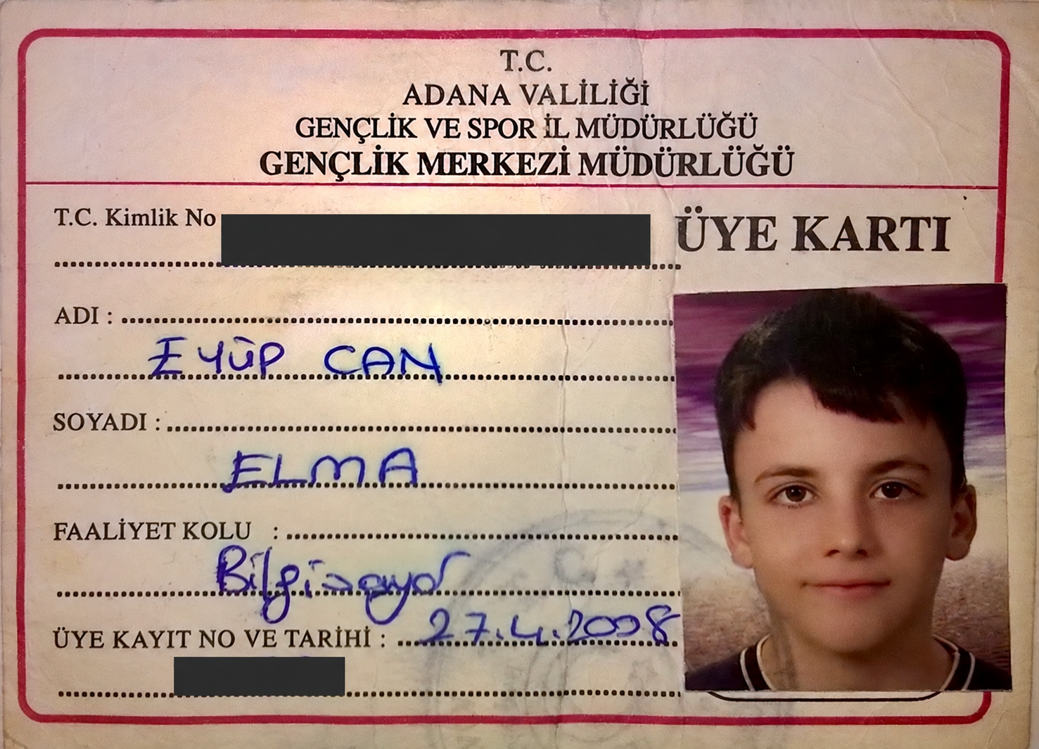 my childhood membership card for the computer club at adana youth centre, dated 2008; identifying numbers redacted